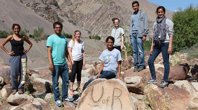 UR Students Posing on Rocks Abroad