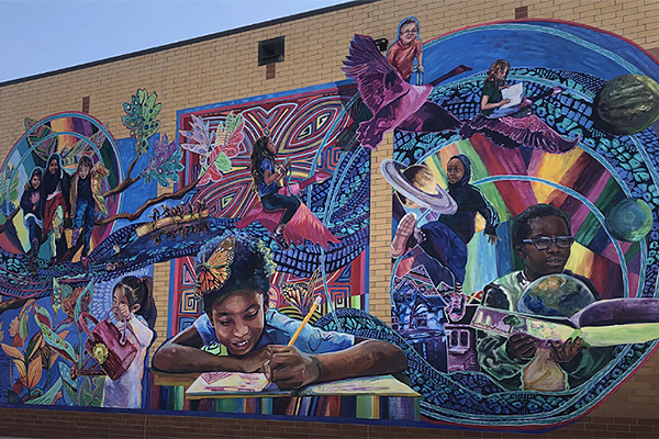 A public mural depicting child in study and play.