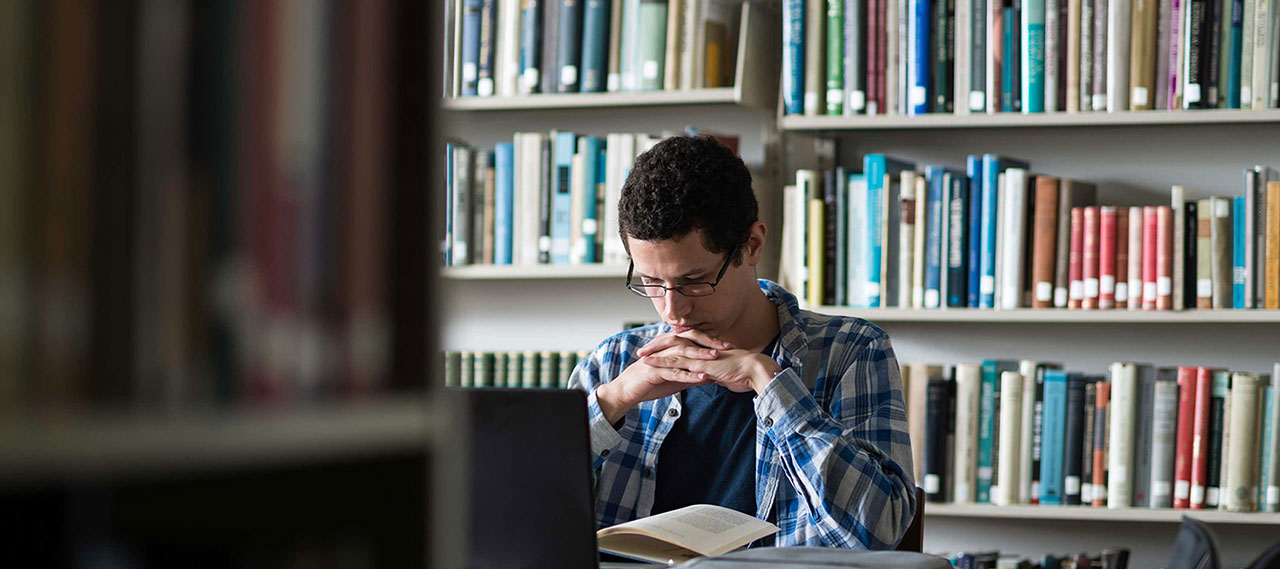 A student studying in a library.