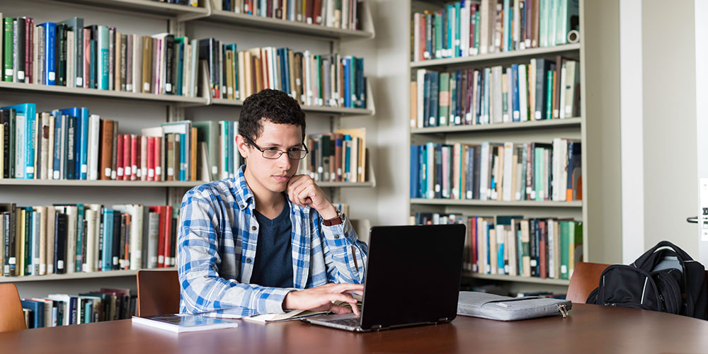 Yanssel Garcia, a fourth year PhD student in philosophy is pictured in Beck Library.