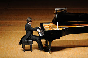 Daniel Vnukowski playing the piano.