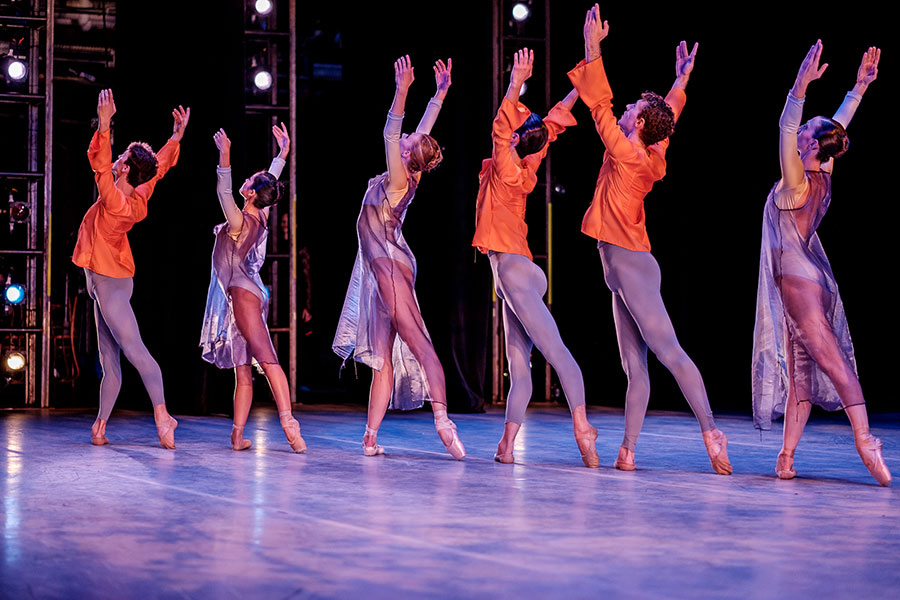 Ballet dancers performing on stage.