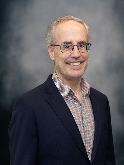 Headshot of Andrew Elliot.