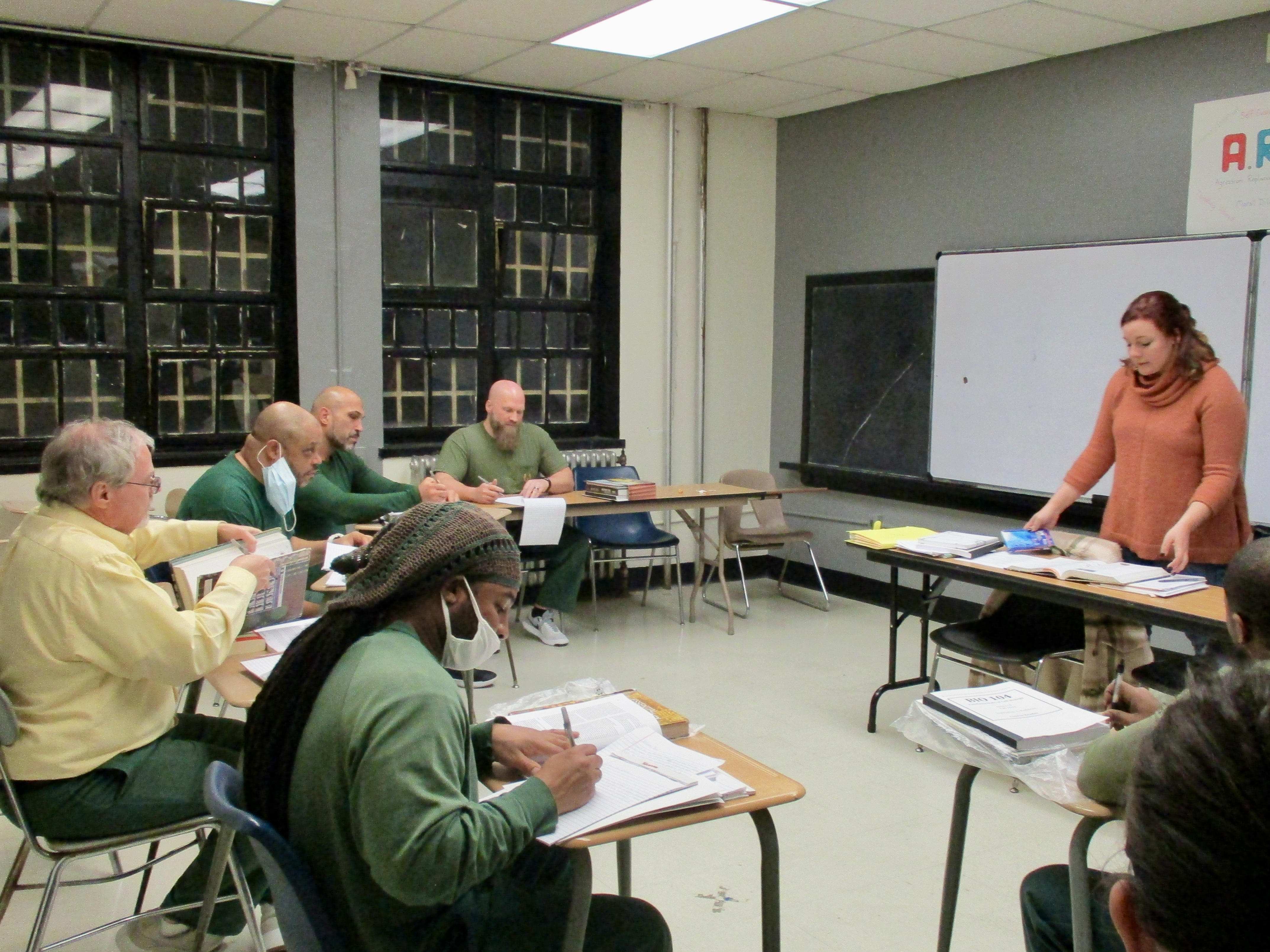 A REJI instructor teaches in a classroom at Attica Correctional Facility
