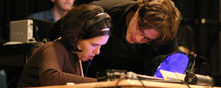 Two students working on set.